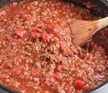 Ground Beef with Tomato sauce and other ingredients in a pan on heat