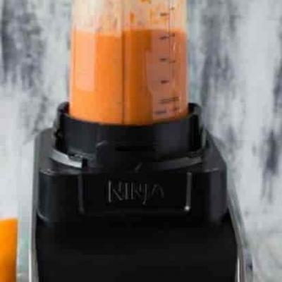Orange smoothie in blender