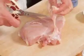 Cut the fat from chicken breast