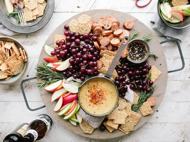 Charcuterie board with crackers and dip